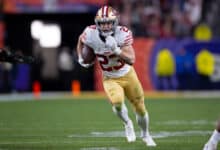 LAS VEGAS, NV - FEBRUARY 11: Christian McCaffrey #23 of the San Francisco 49ers heads to the end zone on a 21-yard touchdown catch during Super Bowl LVIII against the Kansas City Chiefs at Allegiant Stadium on February 11, 2024 in Las Vegas, Nevada. The Chiefs defeated the 49ers 25-22.