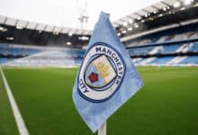Manchester City logo on a corner flag inside the Ethiad Stadium