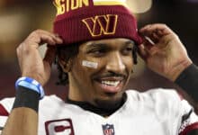 TAMPA, FLORIDA - JANUARY 12: Jayden Daniels #5 of the Washington Commanders smiles after an NFL football wild card playoff game against the Tampa Bay Buccaneers at Raymond James Stadium on January 12, 2025 in Tampa, Florida.