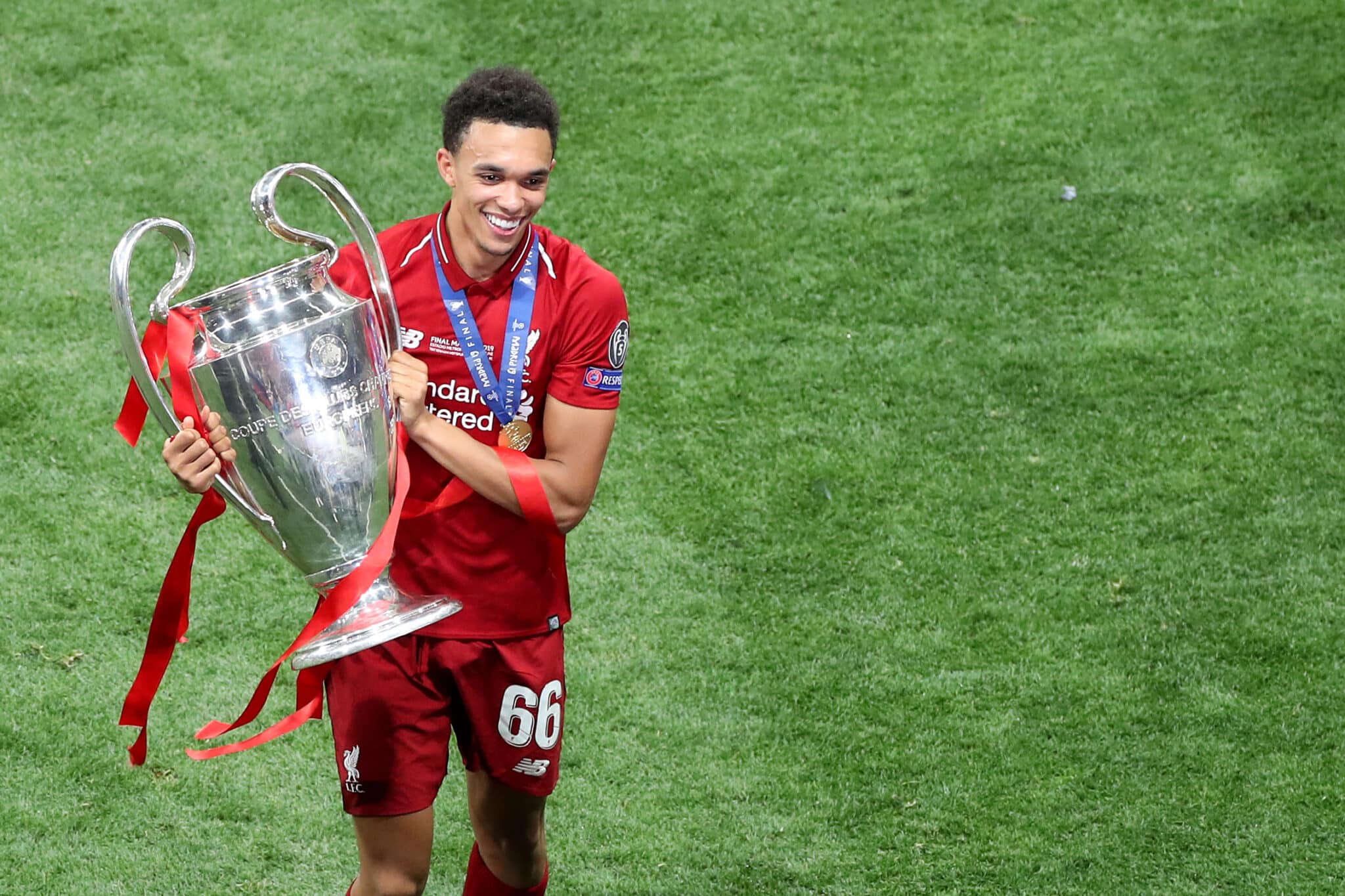 MADRID, SPAIN - JUNE 01: A smiling Trent Alexander-Arnold of Liverpool with the trophy during the UEFA Champions League Final between Tottenham Hotspur and Liverpool at Estadio Wanda Metropolitano on June 1, 2019 in Madrid, Spain.