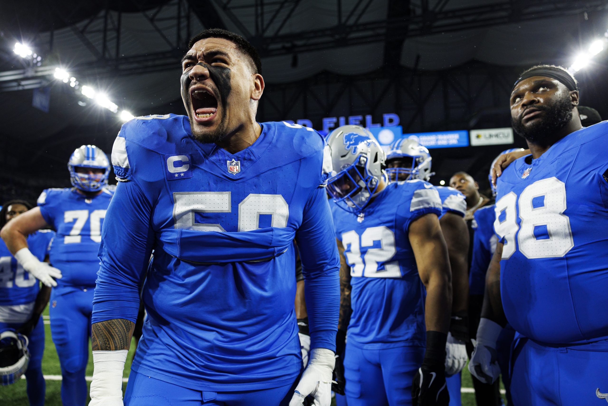 DETROIT, MICHIGAN - JANUARY 18: Offensive tackle Penei Sewell #58 of the Detroit Lions gives a speech in the team huddle prior to the NFC Divisional Playoff game against the Washington Commanders, at Ford Field on January 18, 2025 in Detroit, Michigan.