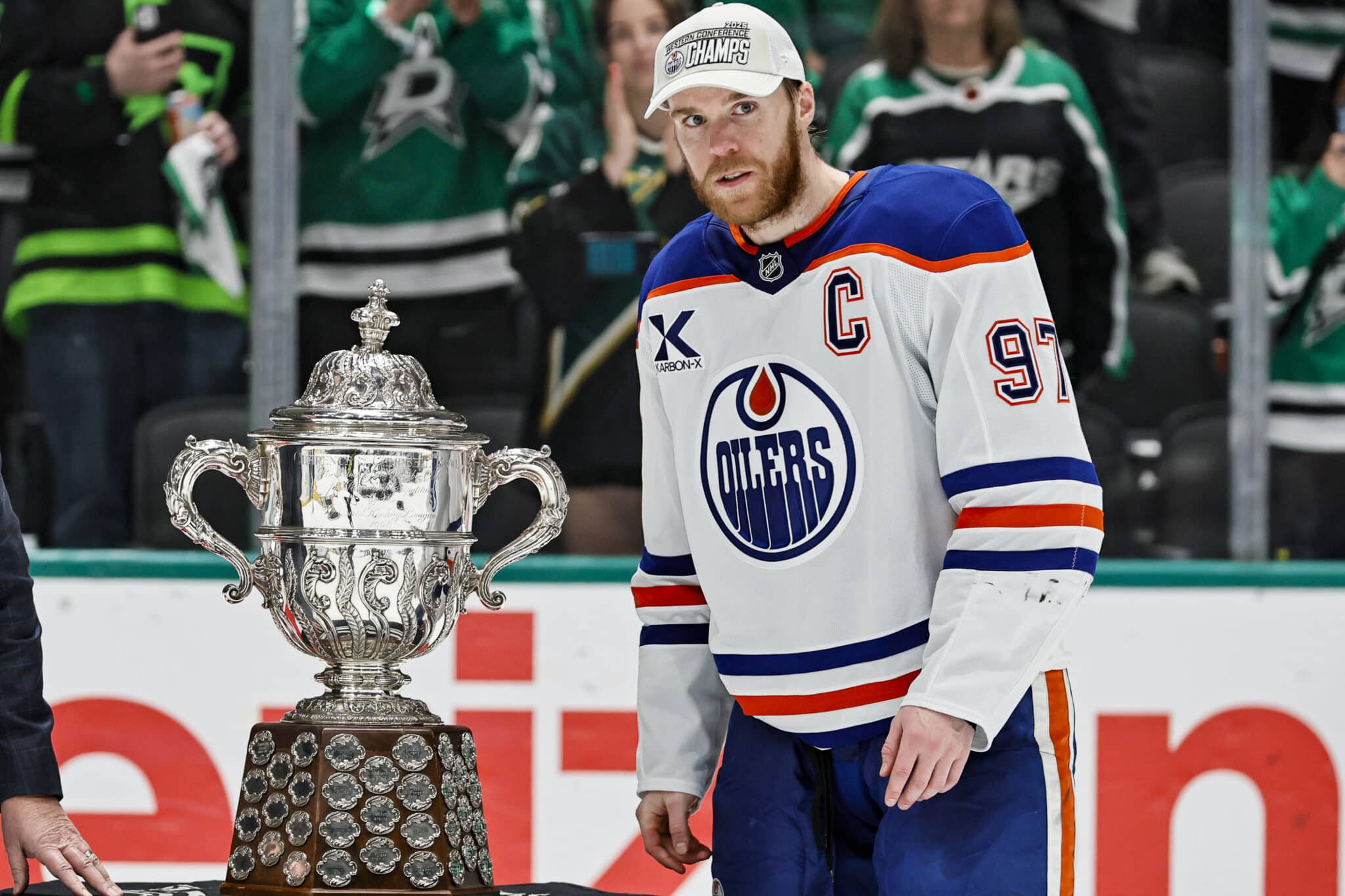DALLAS, TX - MAY 29: Edmonton Oilers center Connor McDavid (97) accepts the Clarence S. Campbell Trophy after game 5 of the Western Conference Final between the Dallas Stars and the Edmonton Oilers on May 29, 2025 at American Airlines Center in Dallas, Texas.