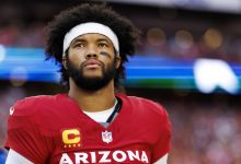 GLENDALE, ARIZONA - JANUARY 5: Quarterback Kyler Murray #1 of the Arizona Cardinals stands on the sidelines during the national anthem prior to an NFL football game against the San Francisco 49ers at State Farm Stadium on January 5, 2025 in Glendale, Arizona.