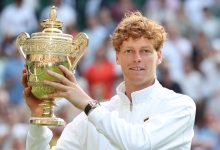 LONDON, ENGLAND - JULY 13: Jannick Sinner (ITA) [1] with the winner's trophy after winning his Gentlemen's Singles Final match against Carlos Alcaraz (ESP) [2] during day fourteen of The Championships Wimbledon 2025 at All England Lawn Tennis and Croquet Club on July 13, 2025 in London, England.