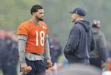 LAKE FOREST, ILLINOIS - JUNE 04: Caleb Williams #18 of the Chicago Bears talks with head coach Ben Johnson during Chicago Bears OTA Offseason Workout at Halas Hall on June 04, 2025 in Lake Forest, Illinois.